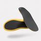 Carbon fiber insoles with a rigid dark plate, slim enough to sit inside a running shoe