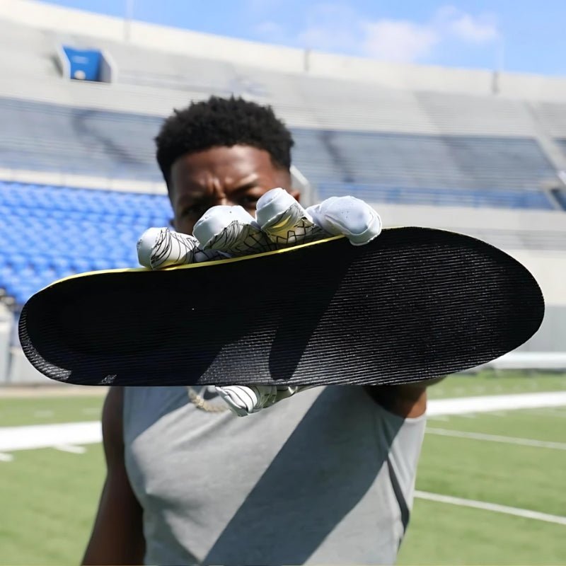 Carbon fiber insoles with a rigid dark plate, slim enough to sit inside a running shoe