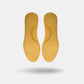 Pink and yellow thermal insoles with an insulating top layer, trimmed to fit inside winter boots