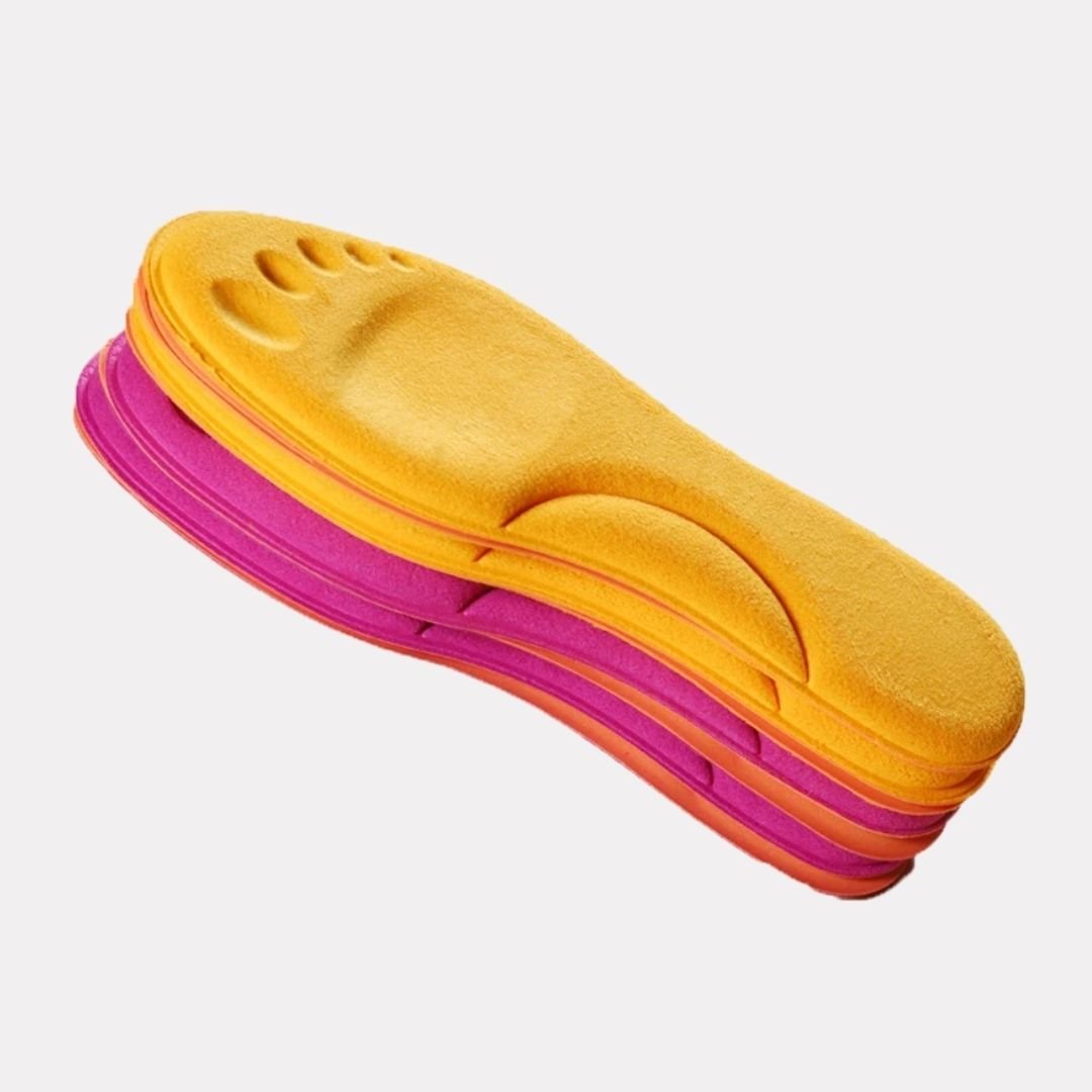 Pink and yellow thermal insoles with an insulating top layer, trimmed to fit inside winter boots