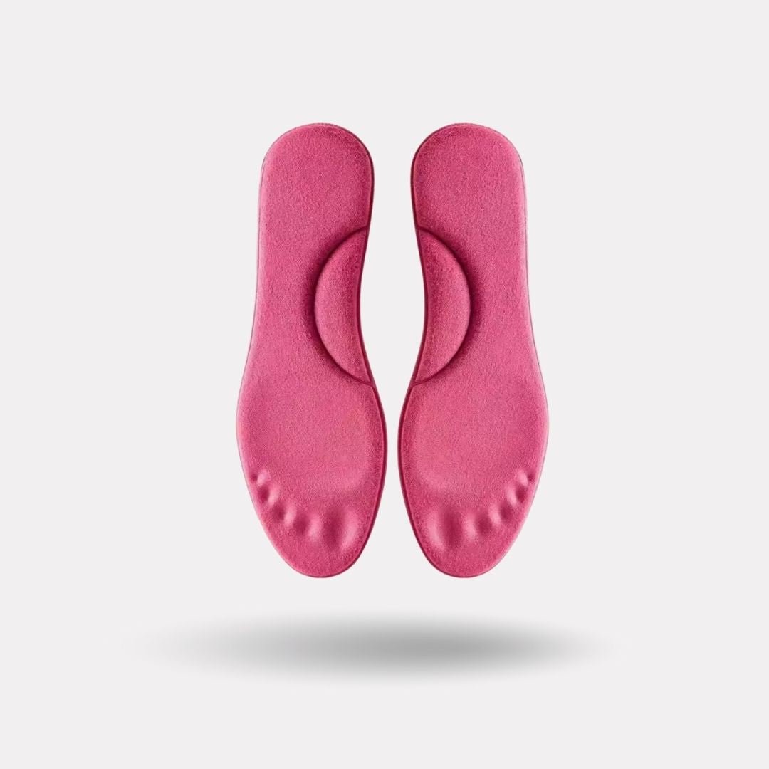 Pink and yellow thermal insoles with an insulating top layer, trimmed to fit inside winter boots