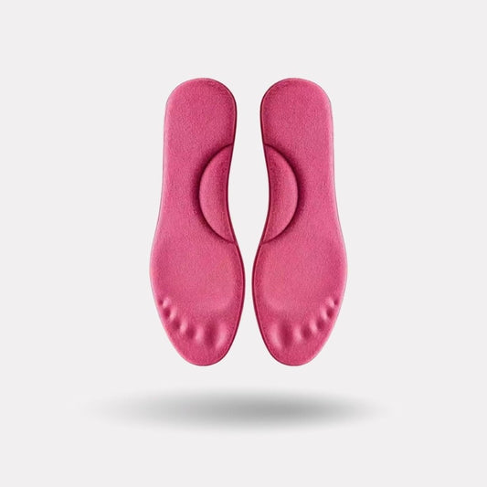 Pink and yellow thermal insoles with an insulating top layer, trimmed to fit inside winter boots