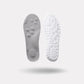 Pair of memory foam orthopedic insoles with a raised arch, worn inside the shoe