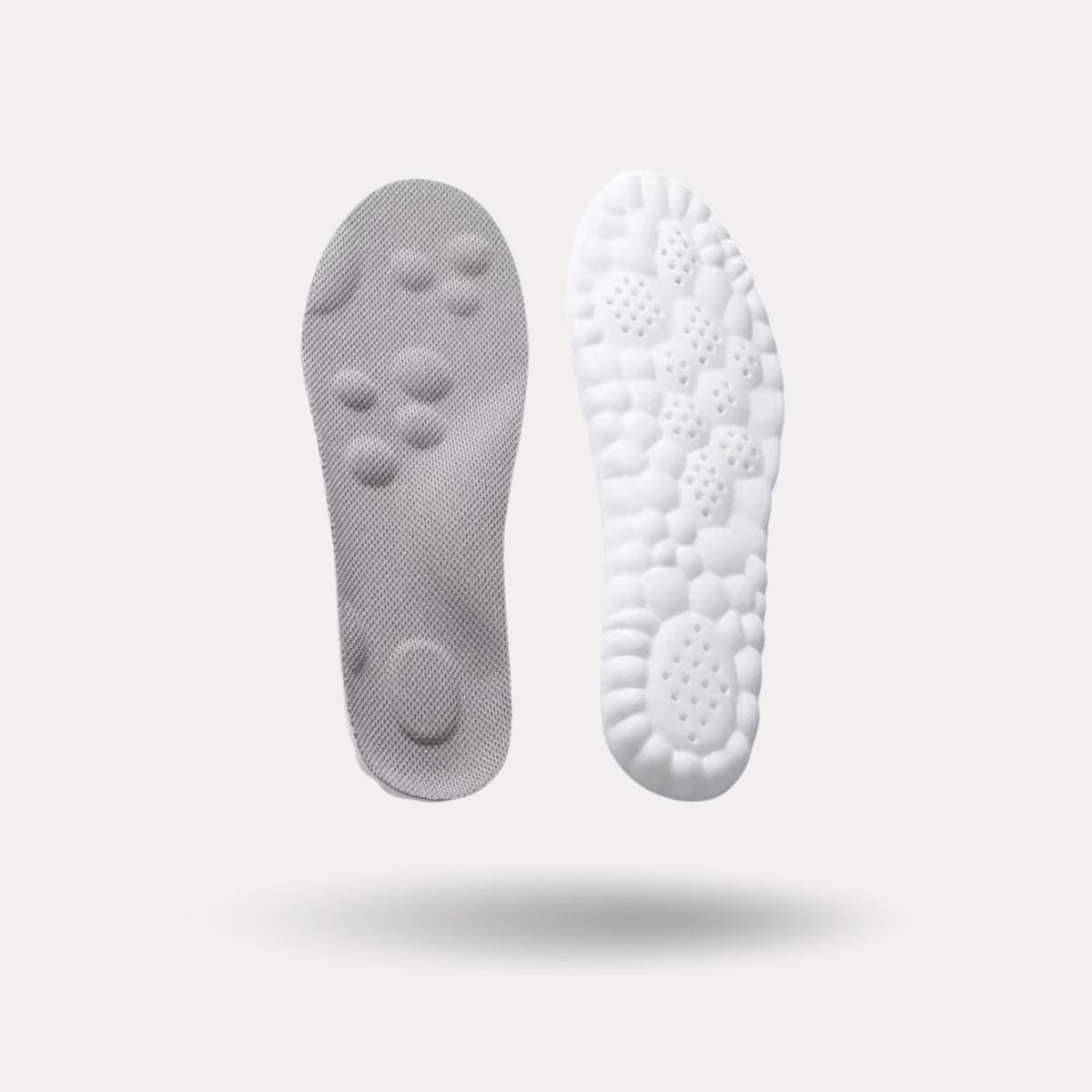 Pair of memory foam orthopedic insoles with a raised arch, worn inside the shoe