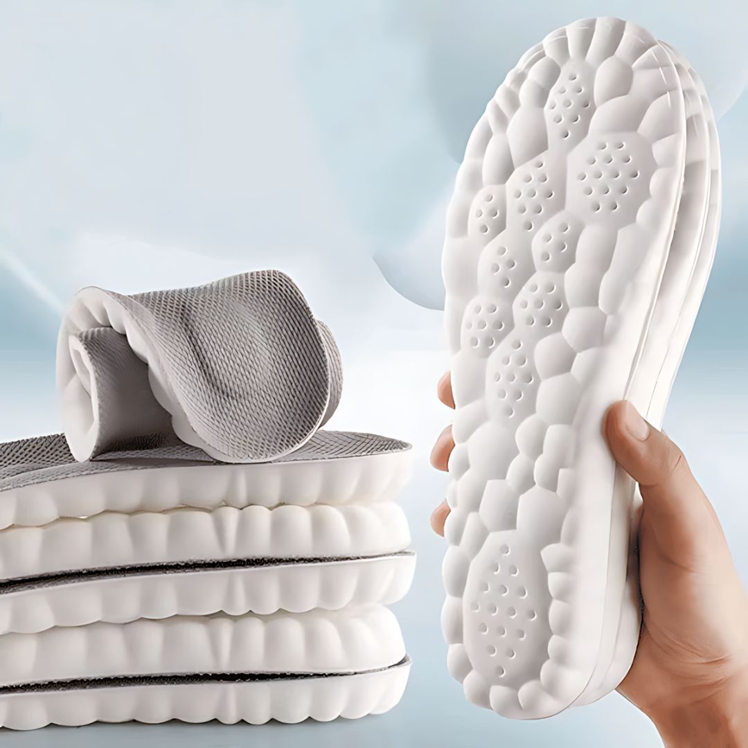 Full-length orthopedic insoles with a molded arch and deep heel cup, worn inside the shoe