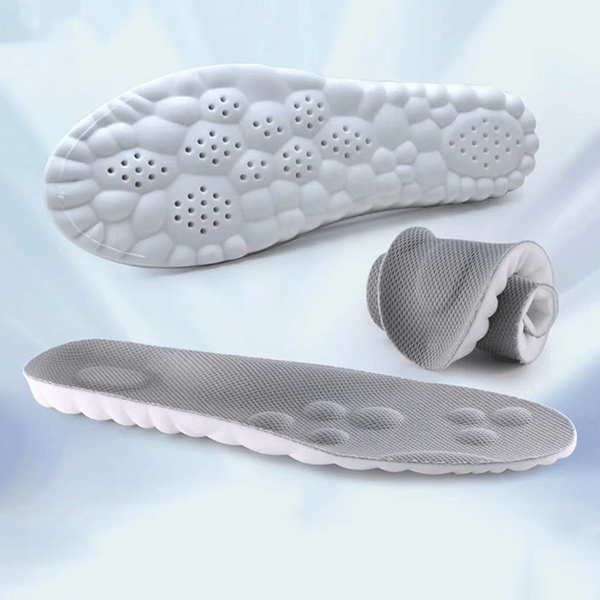 Full-length orthopedic insoles with a molded arch and deep heel cup, worn inside the shoe