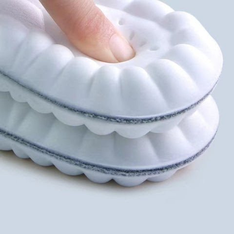 Pair of orthopedic insoles with a molded arch and a cupped heel