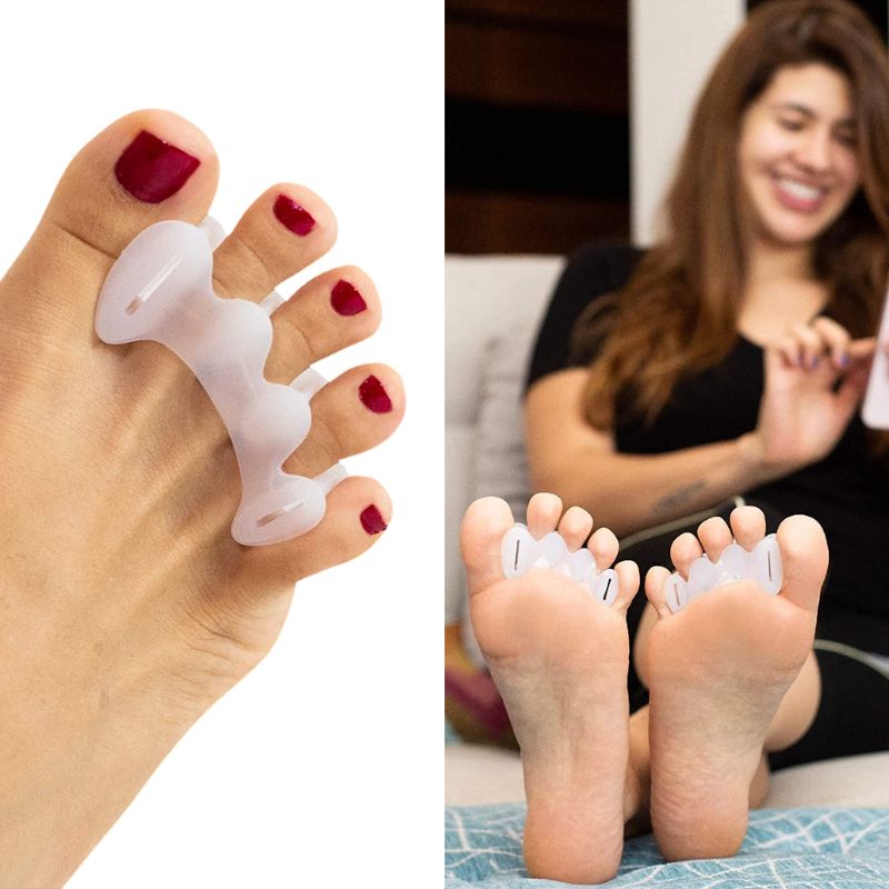 Soft silicone toe separators slotted between the toes to spread them apart