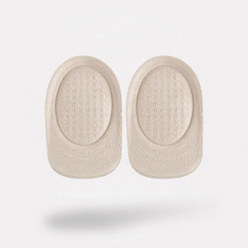 Clear padded cushions lining the heel of a shoe with a non-slip grip
