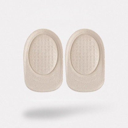 Clear padded cushions lining the heel of a shoe with a non-slip grip