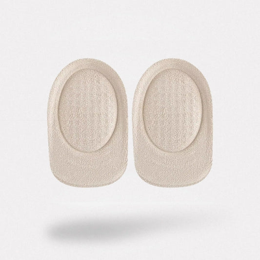 Clear padded cushions lining the heel of a shoe with a non-slip grip