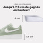Pair of invisible height increase heel lifts placed under the heel inside the shoe