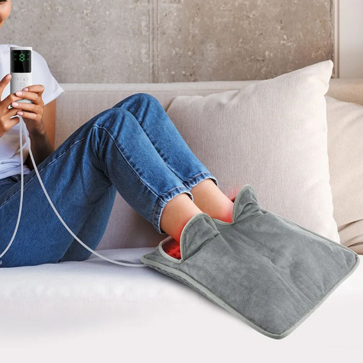 Heated foot mat with a soft top surface where both feet rest for warmth