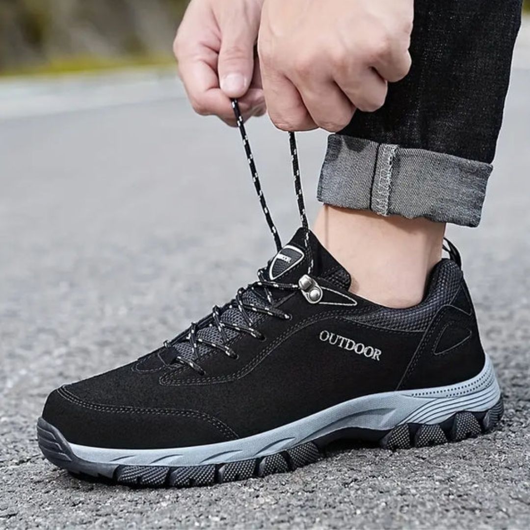 Dark gray hiking shoes with a lugged rubber outsole and a padded ankle collar
